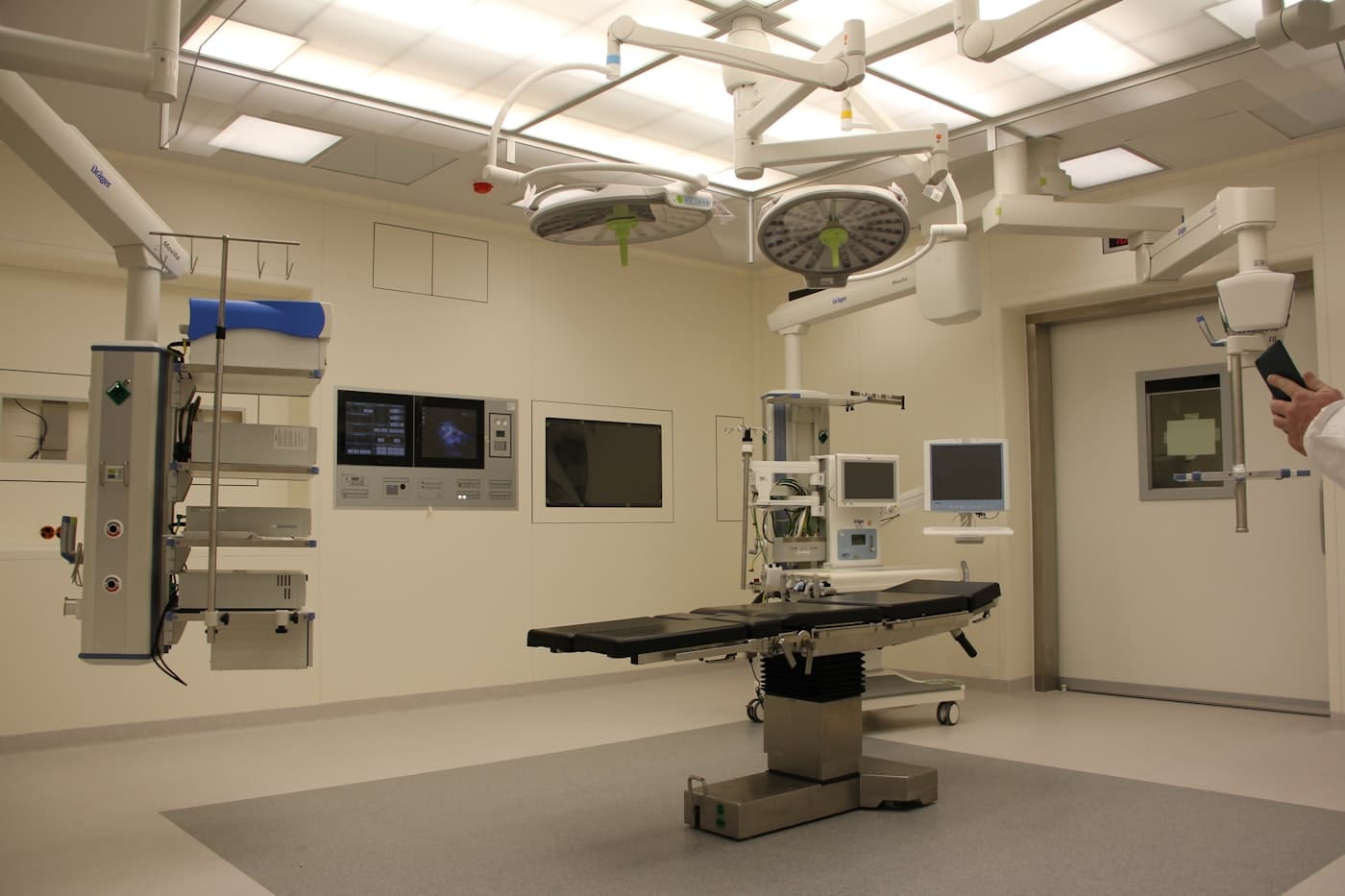 A clean, unoccupied clinical room with medical equipment